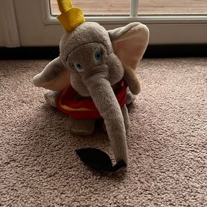 Vintage-Old style Dumbo holding a feather.